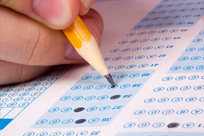 person filling out an OMR sheet