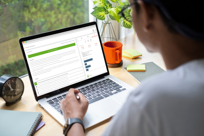 Person on a laptop using the MCQ Simulator