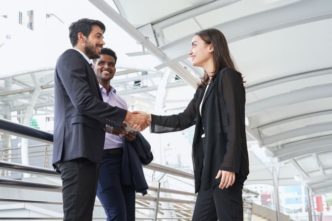 Business people greeting outside of the office
