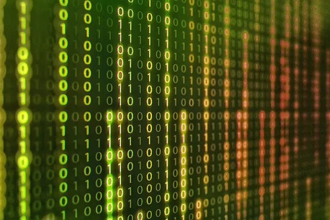 Binary code showing on a computer monitor
