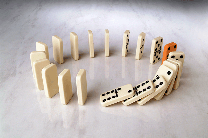 Circle of dominoes lined up 