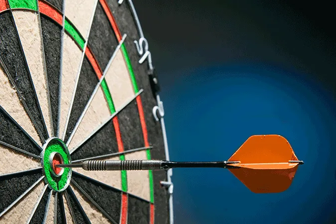 A dart that hit the center bullseye of a dartboard
