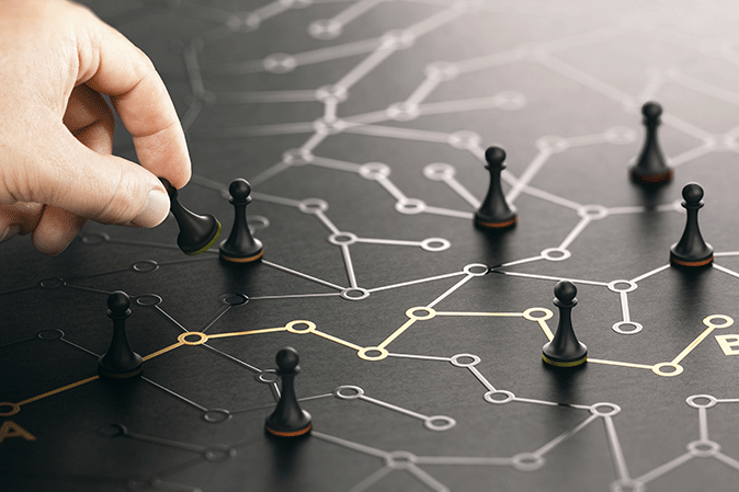 Man moving game pieces on a line with various points