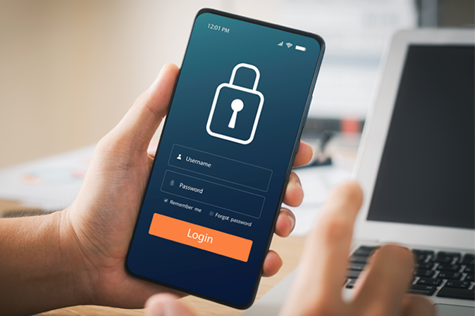 Man holding a mobile device showing a secured login screen
