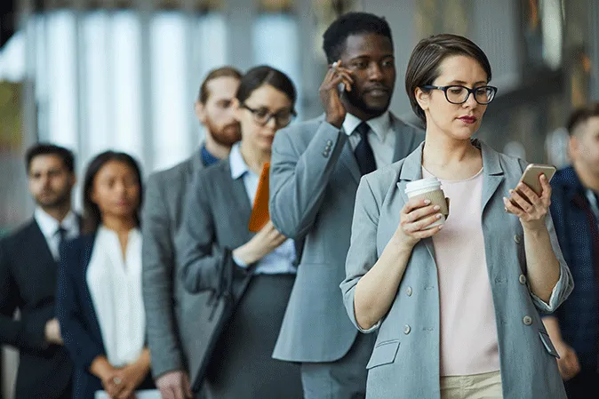Row of professional people standing in a waiting line