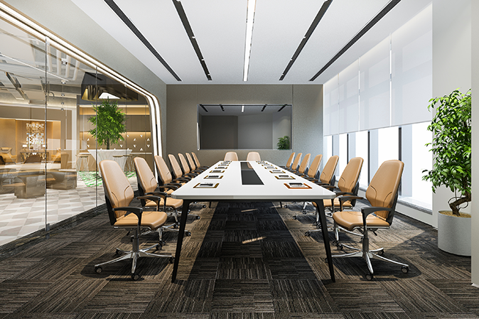 Inside an upscale modern board room with a conference table and chairs