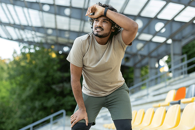 Young man resting after going on a run