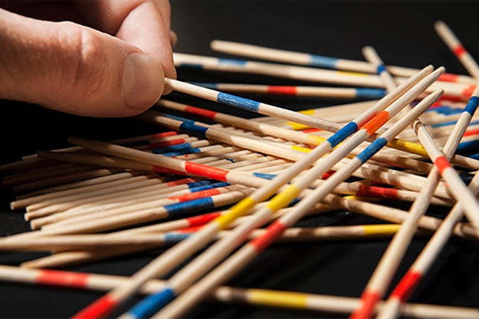 Pick-up sticks game on table