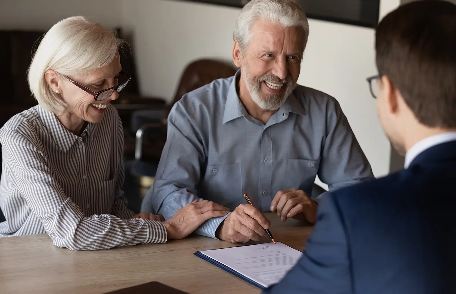 Lawyer working on an estate plan with an elderly couple