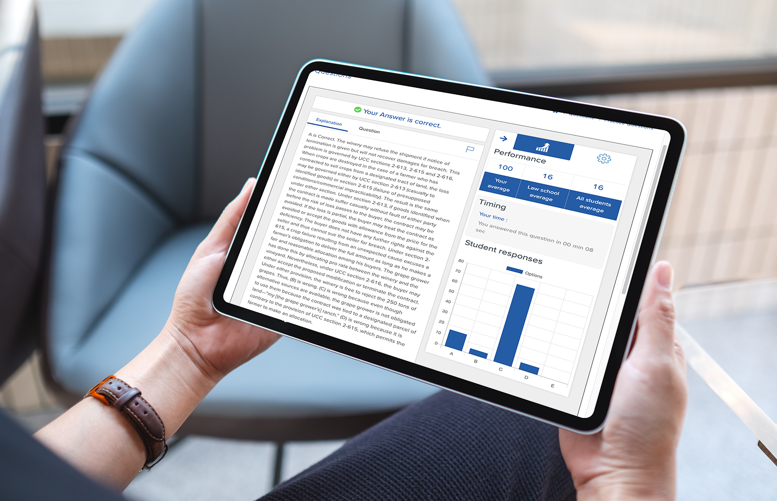 Person holding a tablet showing a question from the bar review personal study plan