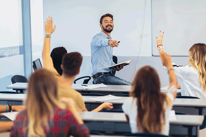 Professor pointing on a student in class to answer a question