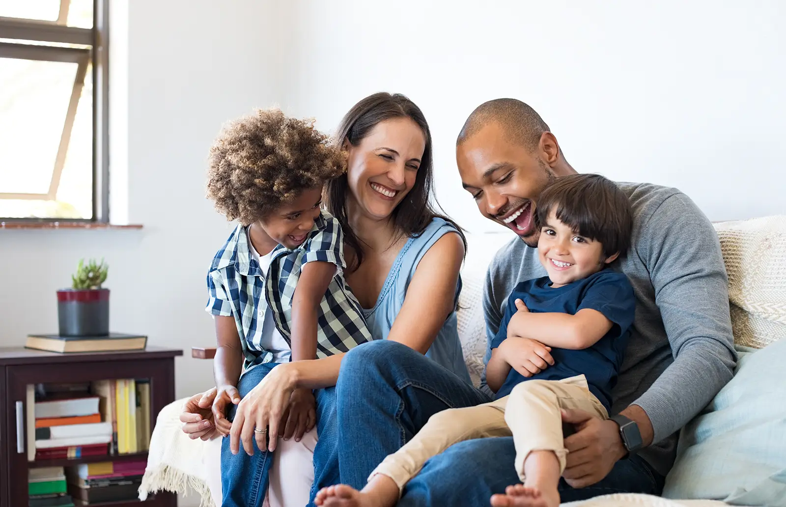 Young multi-racial couple with two multi-racial boys