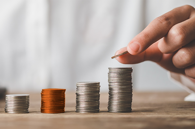 Four stacks of coins going from shortest to tallest