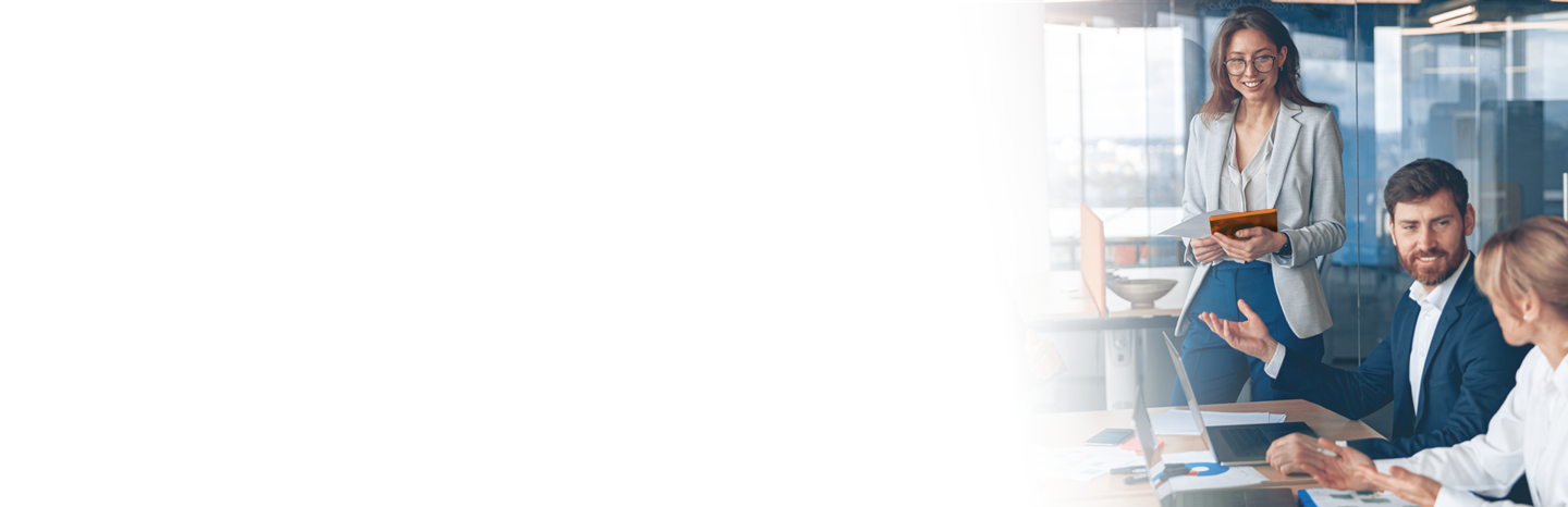 Three business people meeting in an office over a project