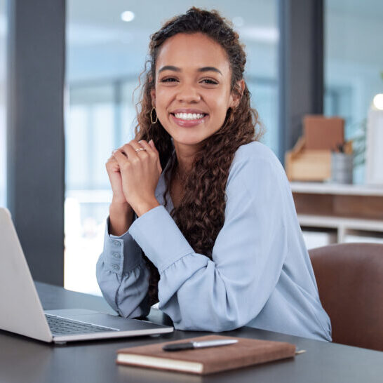 Cropped portrait of an attractive young businesswoman working on her laptop while sitting in the office.